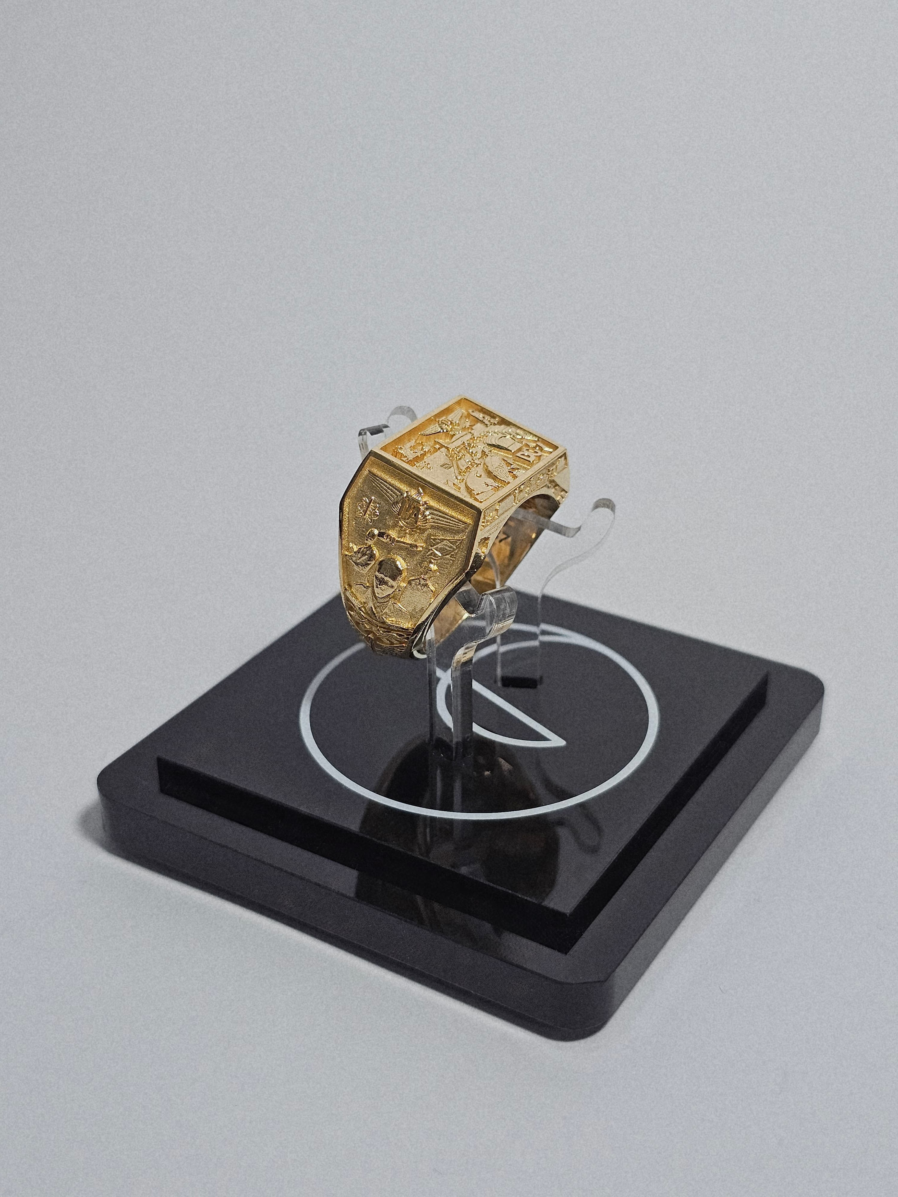 Avrati ring on display with branded base